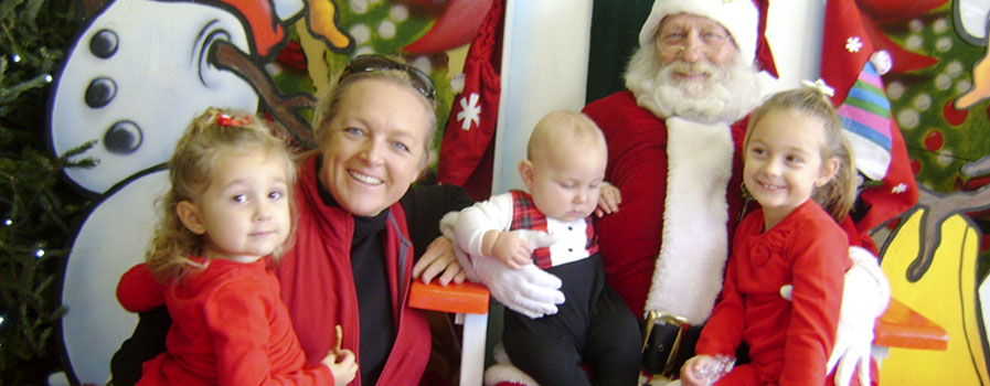 A family visiting with Santa