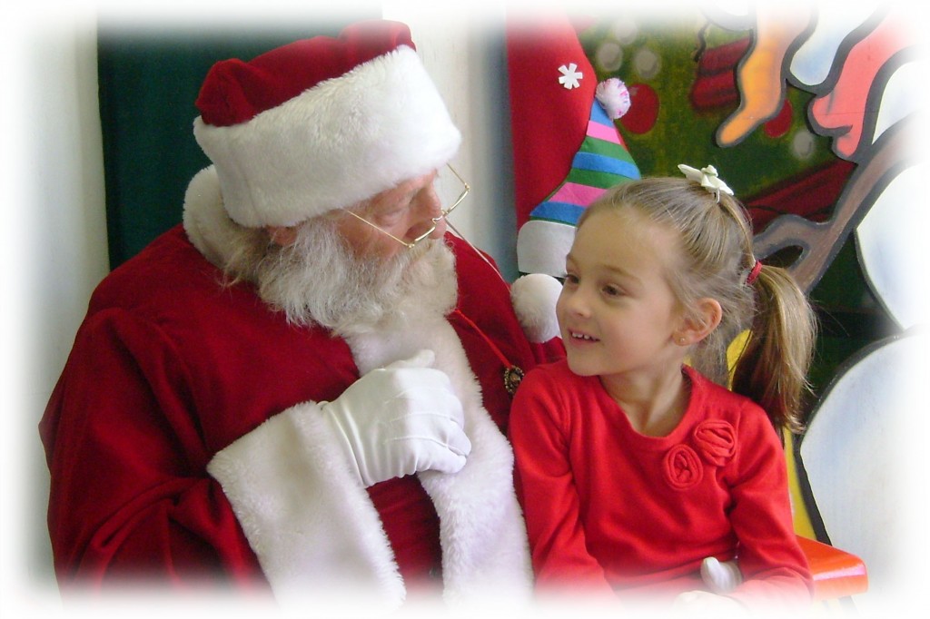 Santa sitting with a child